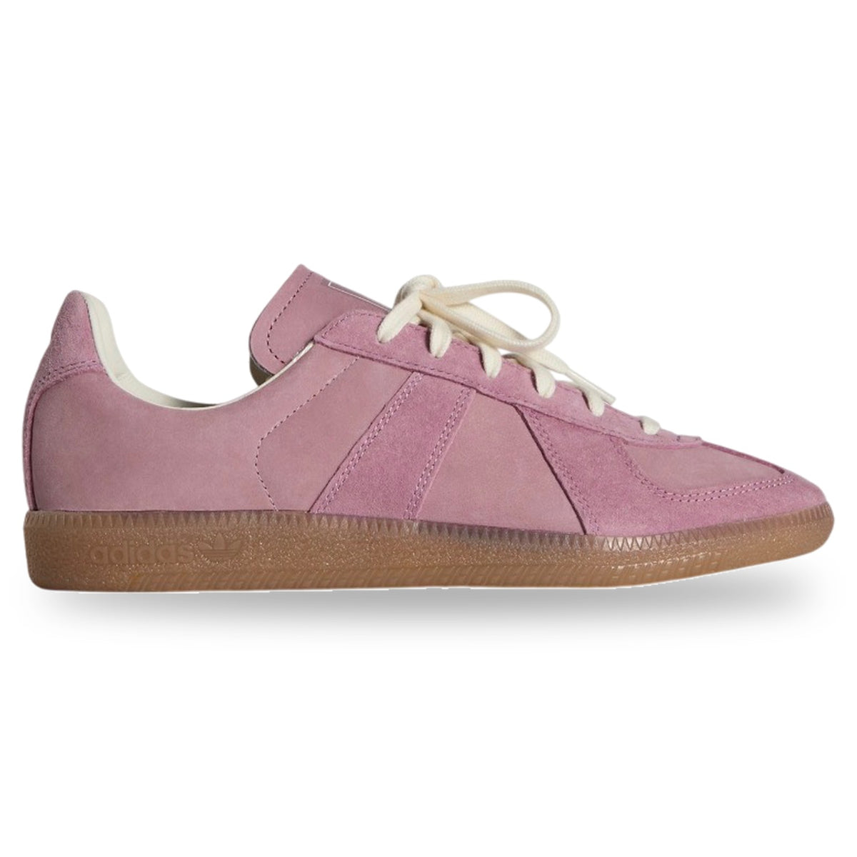 Pink sneaker with a brown sole on a white background