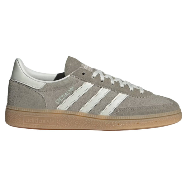 Gray Adidas sneaker with white stripes on a light gray background