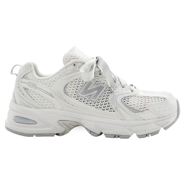 White sneaker with New Balance logo on a white background