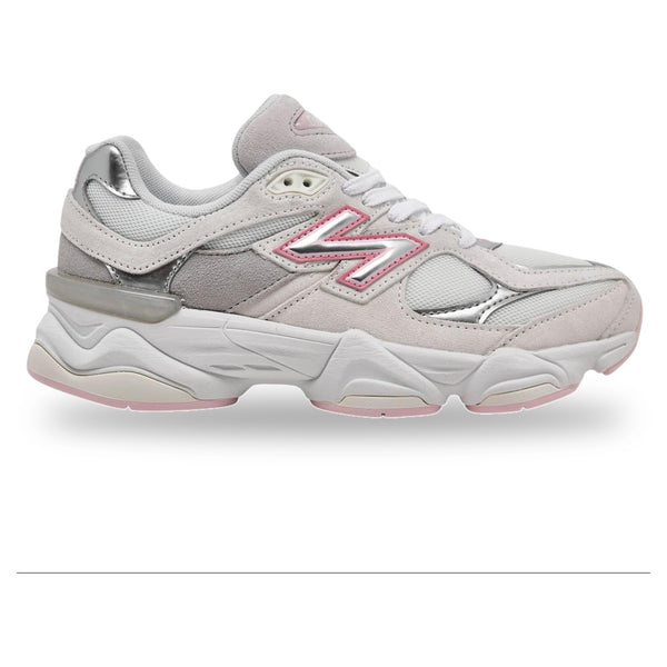 White sneaker with pink accents on a white background