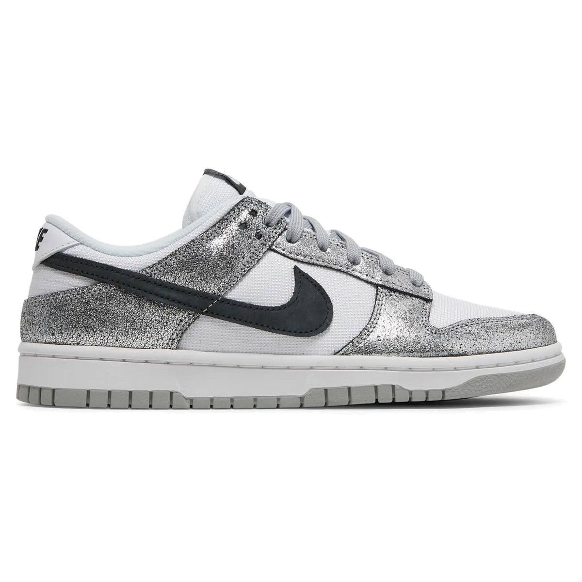 Silver glittery sneaker with black swoosh logo on a white background