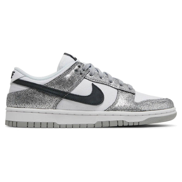 Silver glittery sneaker with black swoosh logo on a white background