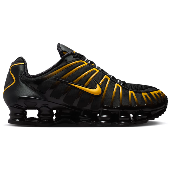 Black and yellow sneaker on a white background