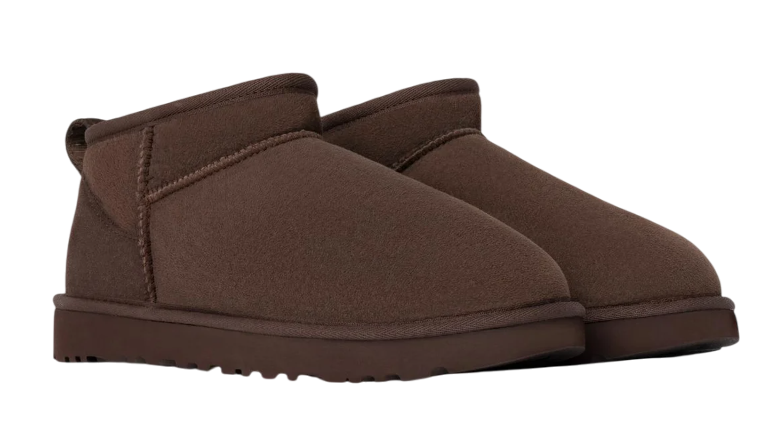 Pair of brown slippers on a white background