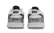 Pair of Nike sneakers with a white sole on a white background