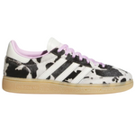 Sneaker with cow print pattern on a white background - Image 1