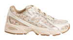 Beige sneaker with floral pattern on a white background - Image 1