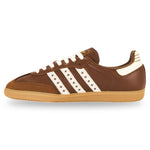 Brown Adidas sneaker with white stripes on a white background - Image 3