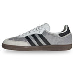 White Adidas sneaker with black stripes on a white background - Image 3