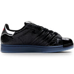 Black sneaker with blue sole on a white background - Image 3