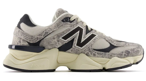 Gray and beige sneaker with black accents on a white background