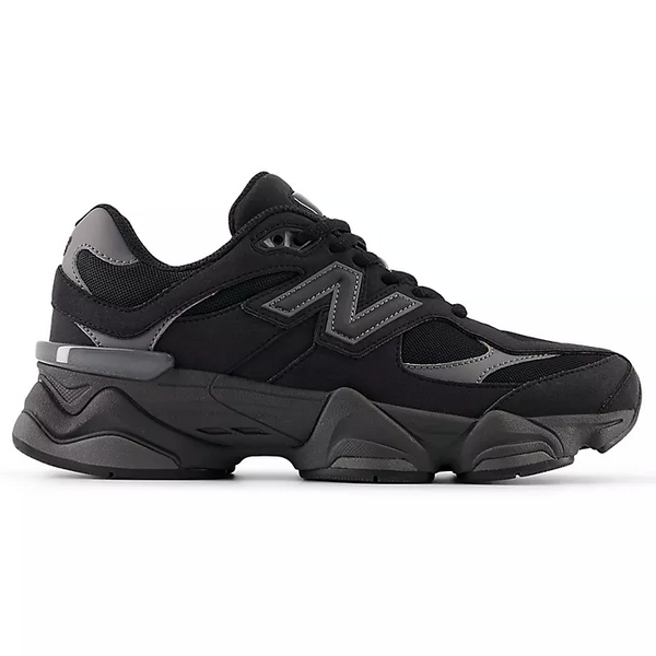 Black athletic shoe with red accents on a white background