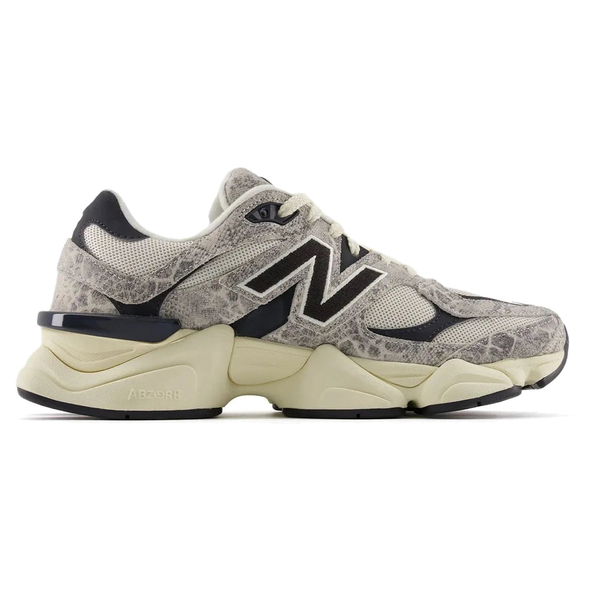 Gray and beige sneaker with black accents on a white background