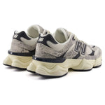 Pair of New Balance sneakers with a snake skin pattern on a white background - Image 2