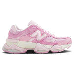 A pair of New Balance 9060 pink overdye sneakers with a mesh upper and a rubber sole. - Image 1