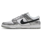 White sneaker with black swoosh logo and silver glittery side panel on a white background - Image 3