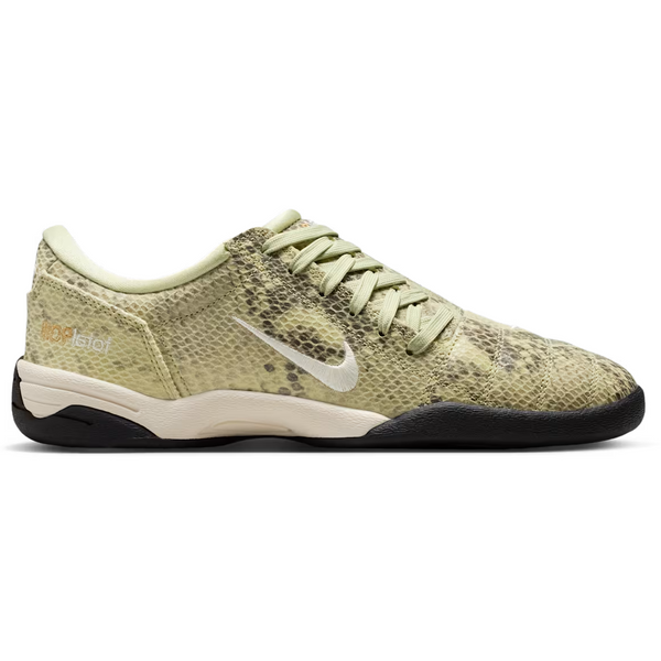 Beige sneaker with brown sole on a white background