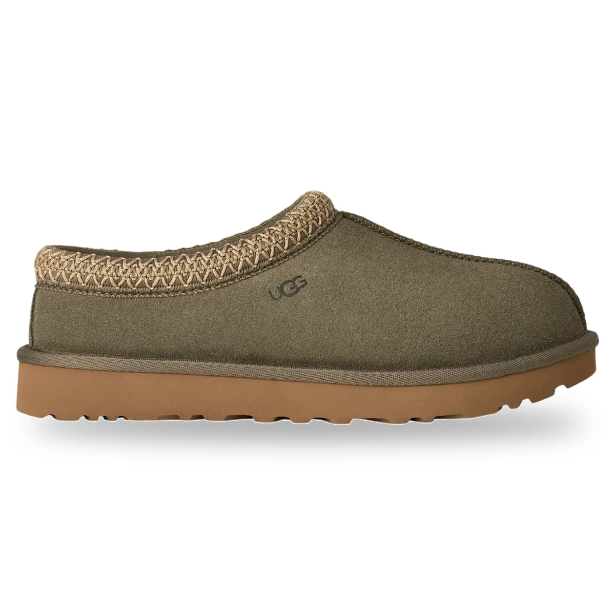Green slip-on shoe with brown sole on a white background