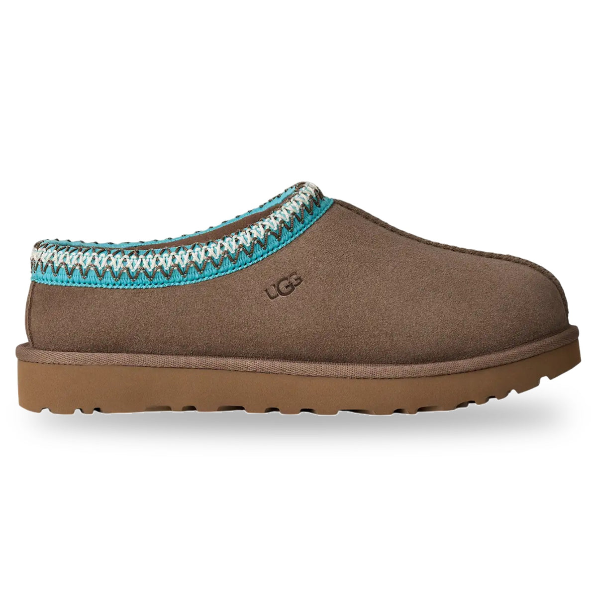 Brown UGG slipper with decorative trim on a white background