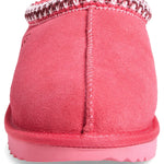 Pink slip-on shoe with a textured sole on a white background - Image 5