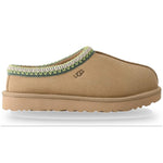 Tan slipper with green trim on a white background - Image 1