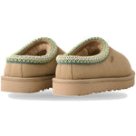 Pair of tan slippers with green trim on a white background - Image 2