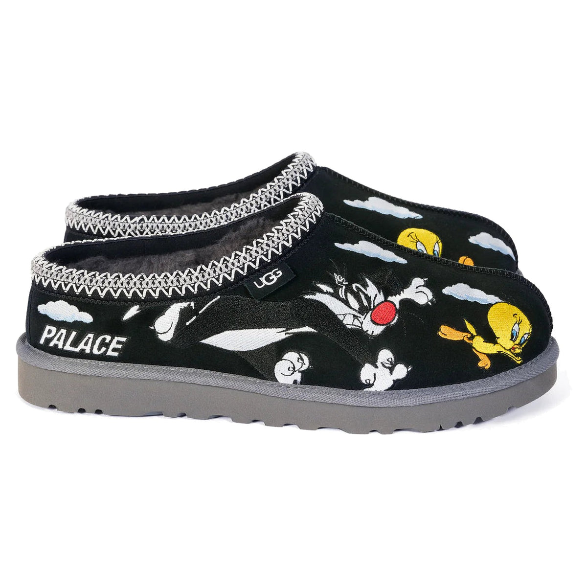 Black slippers with cartoon character design and 'Palace' branding on a white background