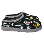 Black slippers with cartoon character design and 'Palace' branding on a white background - Image 1