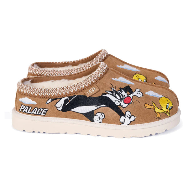 Brown slippers with cartoon characters and 'Palace' branding on a white background