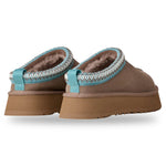 Pair of brown slippers with turquoise trim on a white background - Image 3