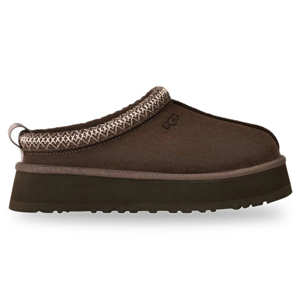 Brown slipper with decorative trim on a white background