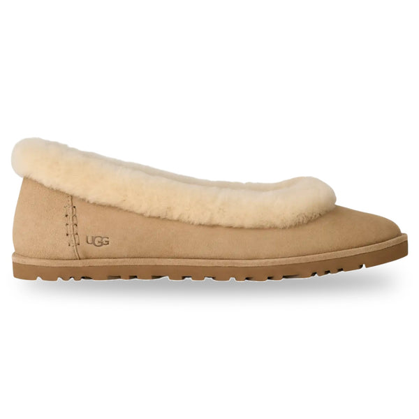 Beige UGG slipper with fluffy trim on a white background