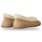 Pair of tan UGG slippers with sheepskin lining on a white background - Image 4